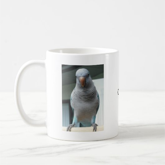 青いクエーカー教徒のオウム コーヒーマグカップ (左)