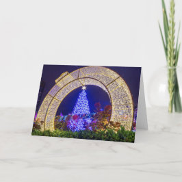 青いクリスマスツリーがクリスマスボールにフレームインされた カード