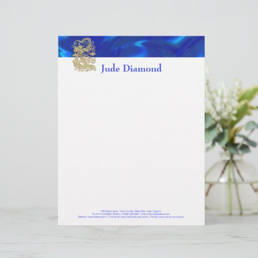 青いサテンの上に浮き彫りされた金のドラゴン レターヘッド (スタンド正面)