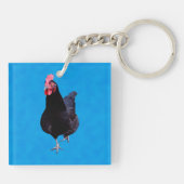 青いスポンジの上に黒い鶏を置き キーホルダー (裏面)