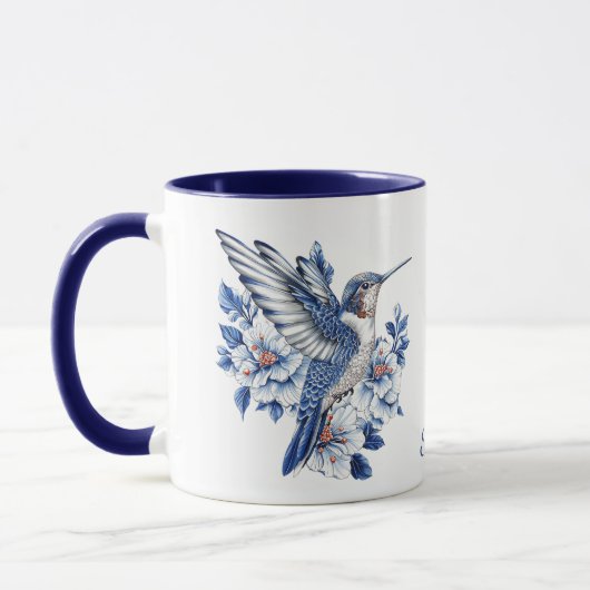 青いハチドリの花のモノグラム マグカップ (左)