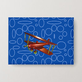 青い円とループの赤い飛行機 缶バッジ