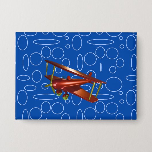 青い円とループの赤い飛行機 缶バッジ (正面)