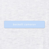 青い子供がアイロンを衣類に付ける ラベル (デザイン1)