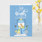 青い帽子を被った雪だるま - 冬の訪れ カード (黄色い花)