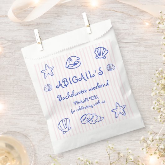 青い手書きの落書き貝殻のバチェロレッテ フェイバーバッグ (クリップ留めされた状態)