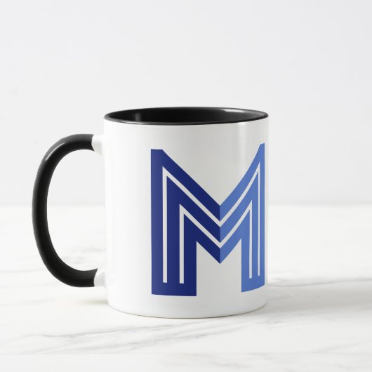 青い抽象幾何学模様のM マグカップ (左)