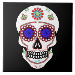 青い目と緑の（紋章の）フラ・ダ・リを持つ砂糖スカル タイル