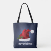 青い背景にクリスマスホーリーと赤いサンタ帽子 トートバッグ (裏面)