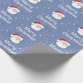 青い背景にサンタと雪の結晶クリスマス ラッピングペーパー (角)