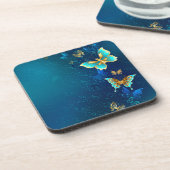 青い背景にチョウが黄金色に コースター (左側)