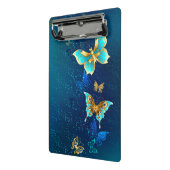 青い背景にチョウが黄金色に ミニクリップボード (アングル2)