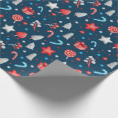 青い背景に星、プレゼント、お菓子の模様 ラッピングペーパー (角)