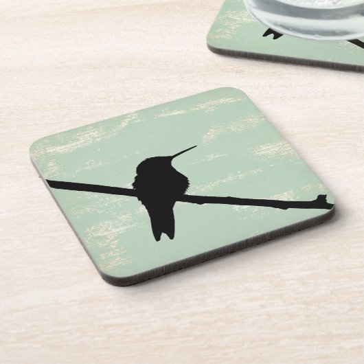 青い背景に浮かぶハチドリグランジシルエット コースター (左側)