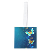 青い背景に浮かぶ金色の蝶 キューブオーナメント (正面)