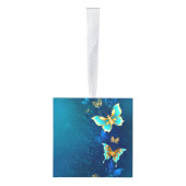 青い背景に浮かぶ金色の蝶 キューブオーナメント (右)