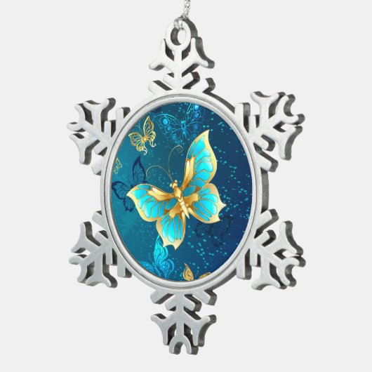 青い背景に浮かぶ金色の蝶 スノーフレークピューターオーナメント (右)