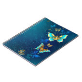 青い背景に浮かぶ金色の蝶 ノートブック (左側)