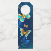 青い背景に浮かぶ金色の蝶 ボトルネックタグ (裏面)