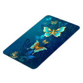 青い背景に浮かぶ金色の蝶 マグネット (左側)