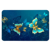 青い背景に浮かぶ金色の蝶 マグネット (横)