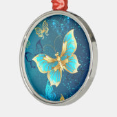 青い背景に浮かぶ金色の蝶 メタルオーナメント (左)