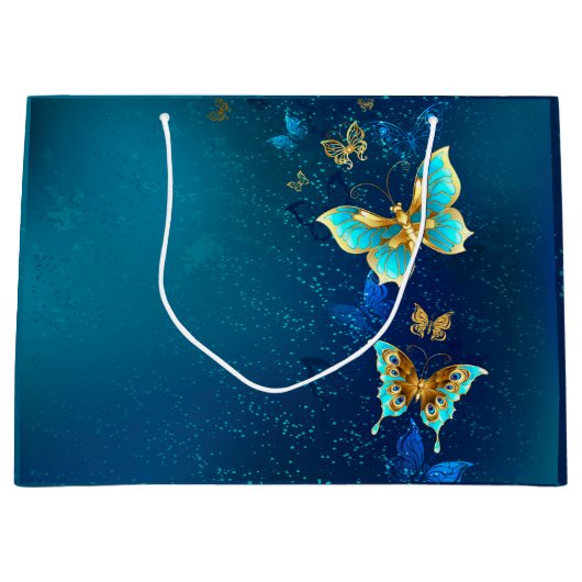 青い背景に浮かぶ金色の蝶 ラージペーパーバッグ (正面)