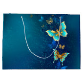 青い背景に浮かぶ金色の蝶 ラージペーパーバッグ (裏面)