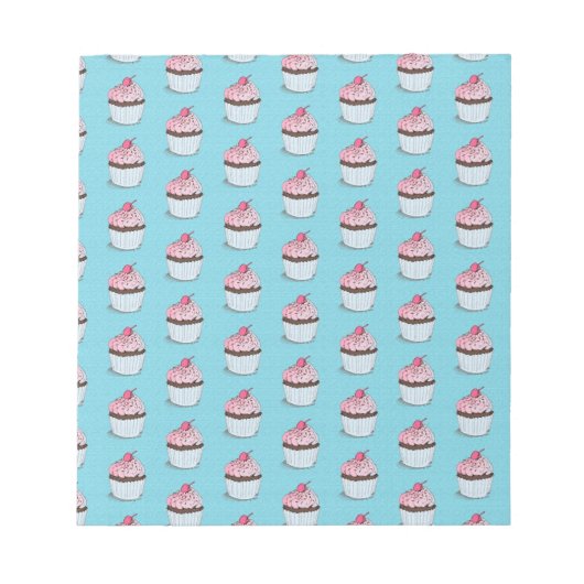 青い背景のかわいいカップケーキ ノートパッド (正面)