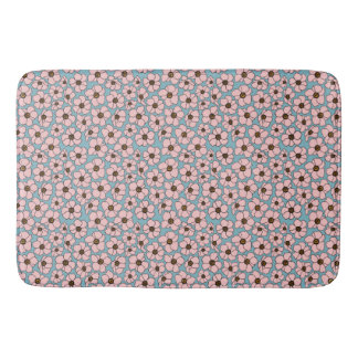 青い背景のピンクの花 バスマット