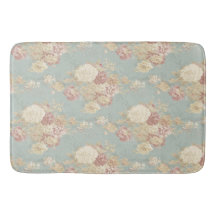 青い背景のピンク色の白い赤面バラ