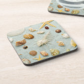 青い背景の分類された貝殻 コースター (左側)