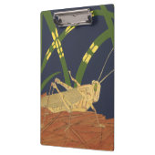 青い背景の緑の草の中のバッタ クリップボード (左)