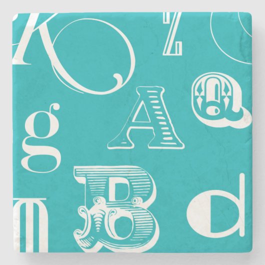 青い背景の装飾的な手紙 ストーンコースター (正面)