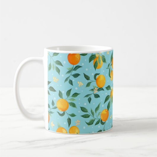 青い背黒に花が咲くオレンジの枝 コーヒーマグカップ (左)