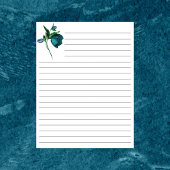 青い花文房具で囲まれた白い紙