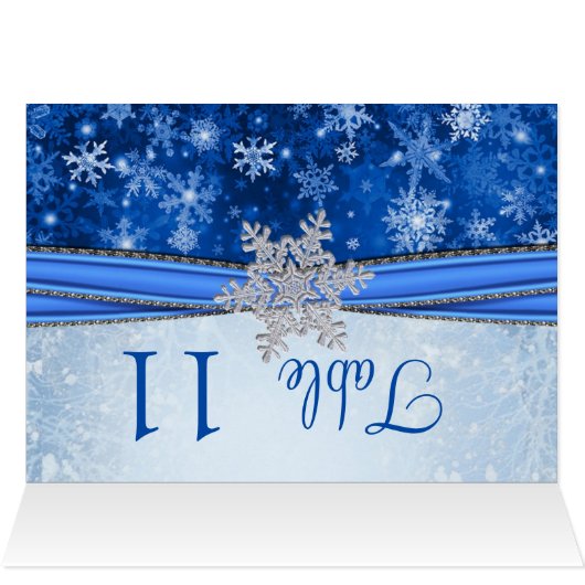 青い表の上の銀のスノーフレーク (内部横(上))