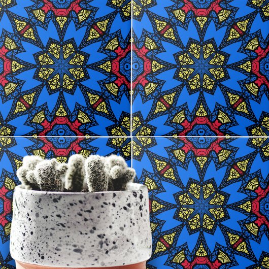 青い赤い黄色のアフリカの民族幾何学模様 タイル