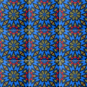 青い赤い黄色のアフリカの民族幾何学模様 タイル