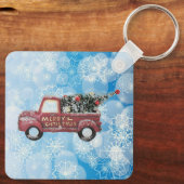 青い雪の上の赤いヴィンテージトラック キーホルダー (裏面)