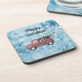 青い雪の上の赤いヴィンテージトラック コースター (左側)