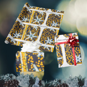 青い黄色の輝くクリスマススター ラッピングペーパー