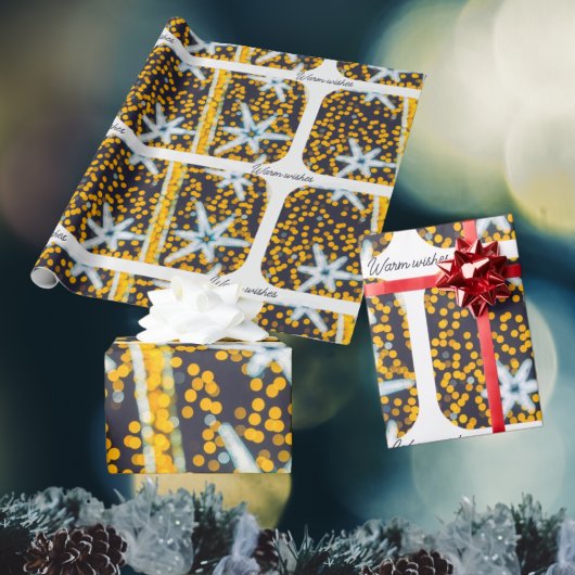 青い黄色の輝くクリスマススター ラッピングペーパー