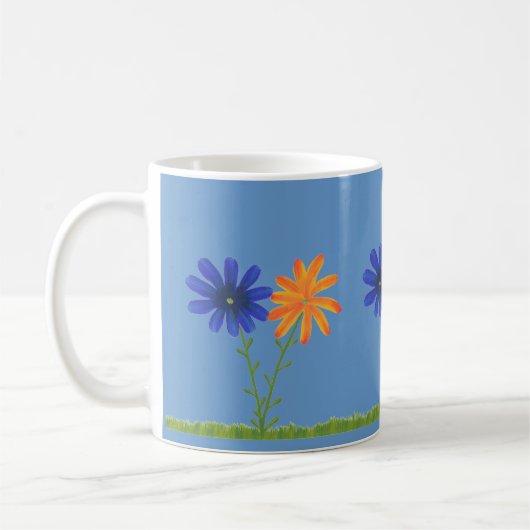 青とオレンジのデイジーの花と草、マグカップ コーヒーマグカップ (左)