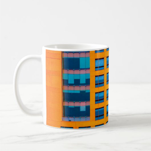 青とオレンジの建物 コーヒーマグカップ (左)