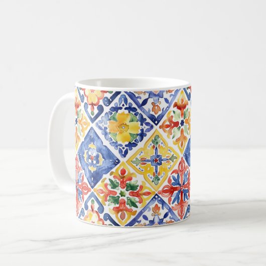 青と赤と黄色の花柄の抽象的なシンコデマヨ コーヒーマグカップ (正面左)