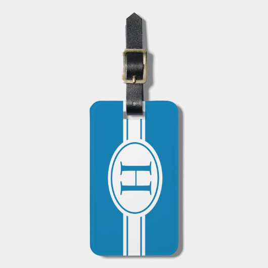 青にモノグラムを施したホワイトバンドと楕円形のシールド ラゲッジタグ (正面縦)