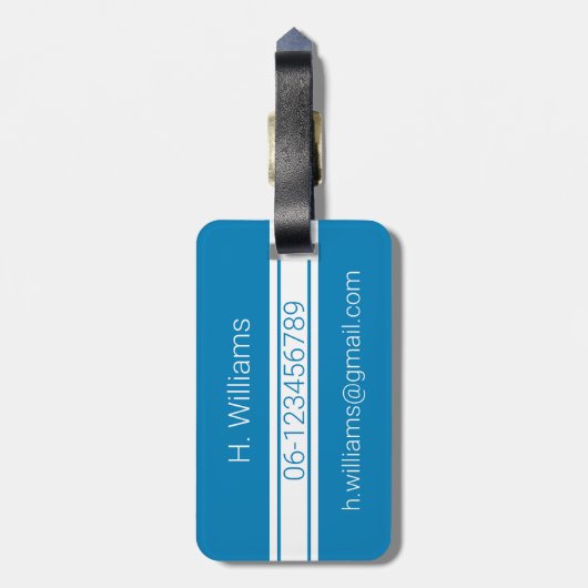 青にモノグラムを施したホワイトバンドと楕円形のシールド ラゲッジタグ (裏面縦)