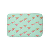 青の上にピンクの恐竜の淡い色の模様 バスマット (正面)