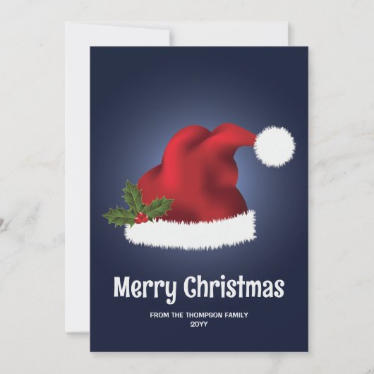 青を背景としたクリスマス・ホーリー付きの赤いサンタ帽子 シーズンカード (正面)